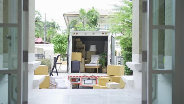 Truck car moving house for customers, delivering boxes and furniture. Vehicle transportation. Shipping and packaging business occupation service company. People lifestyle.