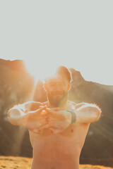 A man stretching his arms after a hard workout in the early hours of the morning
