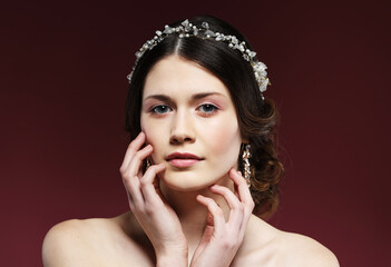Jewelry, luxury, wedding and people concept: young bride with gorgeous diadem in her hair