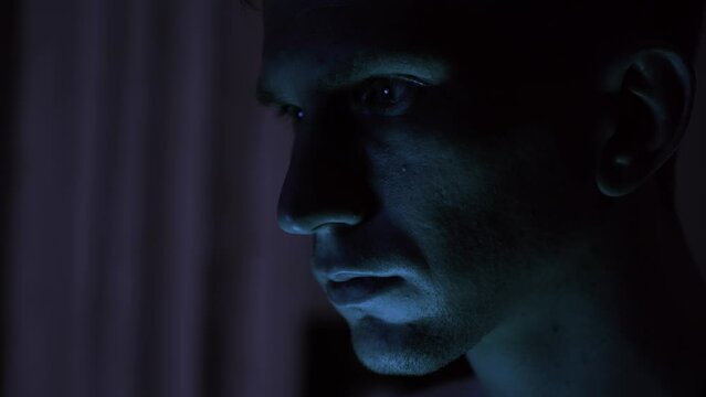 Portrait of a male hacker. nervous look. close-up.
