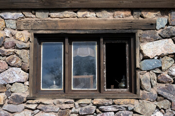 A window in an old rock wall