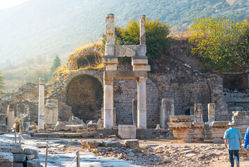 Visitors walk towards the ruins of the ancient Temple of Domitian in the historic center of Ephesus Turkey