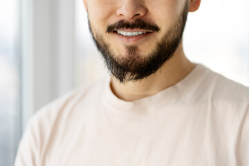 Obraz premium Closeup portrait of handsome smiling bearded man after barbershop 