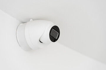 Concept of security, object protection. Invisible, the video surveillance camera is attached under...