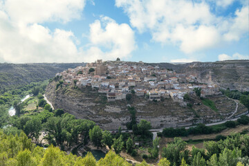 Fototapeta na wymiar Panoramic view of Jorquera the small medieval village in a meander of the river Jucar, province of Albacete. One of the most beautiful villages in Spain.