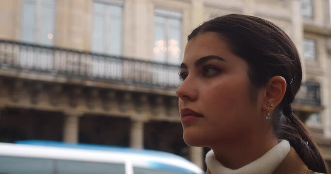 Confident entrepreneur woman walk in streets of Paris, close up view