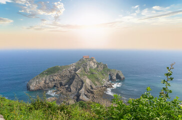 Fototapeta na wymiar View from the top of the sunrise mountain to the island of gaztelugatxe in the basque country.