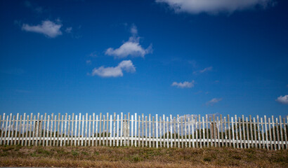 A Rustic old wooden fence protecting peaceful New England meadow