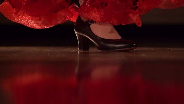 Slow motion close-up footage of a Spanish dancers feet feet during a performance. 