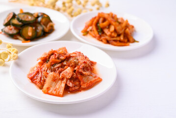 Kimchi cabbage, radish and cucumber  on white background, Korean food homemade side dish