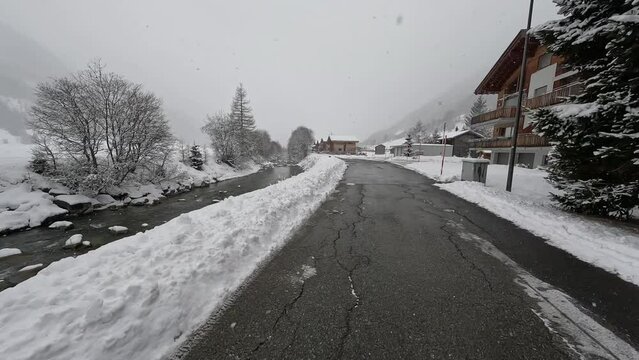 Charming Village Oberwald In The Swiss Alps With Snowfall During Winter In Goms, Valais, Switzerland. wide