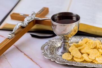 Christian Holy Communion is unleavened bread, chalice wine, symbols death resurrection of Jesus...