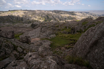 Panoramic view of the rock massif The Giants in Cordoba, Argentina. View of the cliffs and hills under a beautiful sky with clouds. 