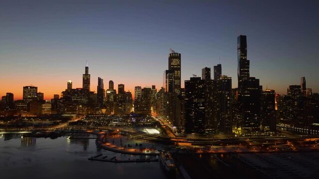 Drone shot around the New Eastside and Loop skyscrapers, dawn in Chicago, USA