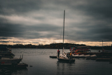 Lone sailor in a boat at Toronto waterfront