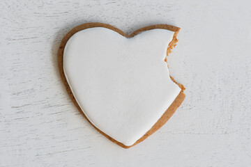 Naklejka na ściany i meble Heart shaped cookie with bite out.