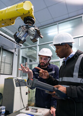 Engineer working in robotics factory