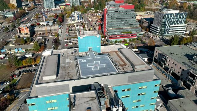 Drone Flying Towards The Surrey Memorial Hospital Helipad In Surrey, BC, Canada. - aerial