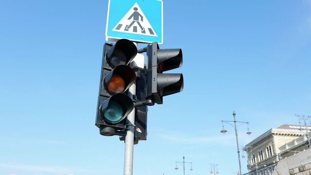 Traffic light turns red blye sky
