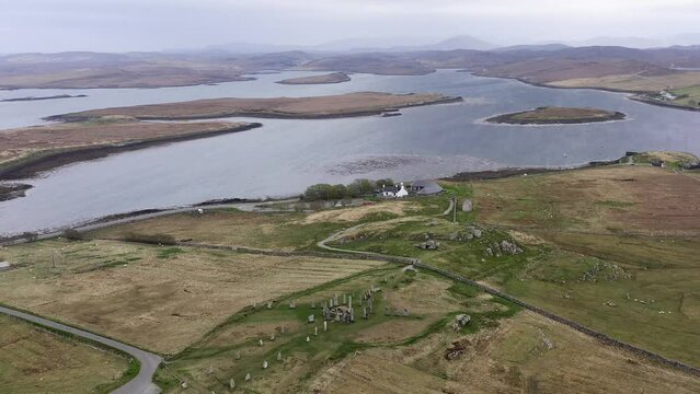 Point-of-interest drone shot of the Callanish Standing Stones. Filmed on the Isle of Lewis, part of the Outer Hebrides of Scotland.