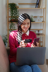 E-Business, Online shopping concept. Asian woman makes a purchase online shopping with credit card.
