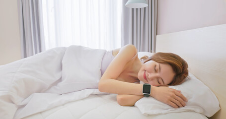 Woman sleeping with smart watch