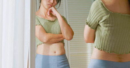 woman dissatisfied about body shape