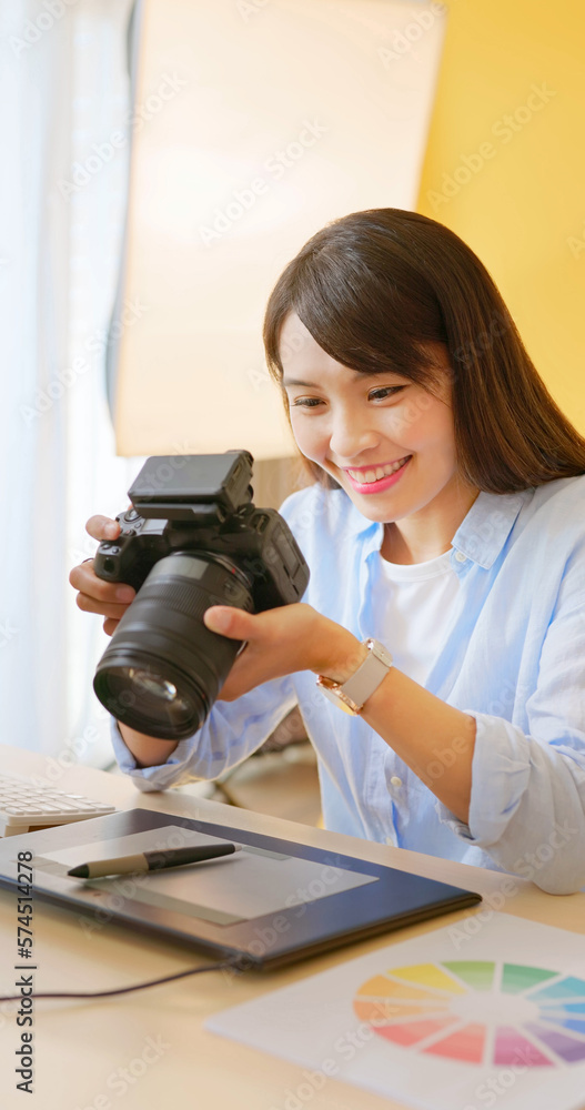 Wall mural female photographer take pictures