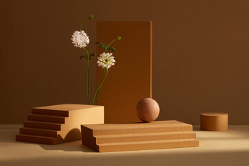 Front view of brown podiums and flowers decorated in brown background