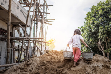 Children working at construction site for world day against child labor concept: