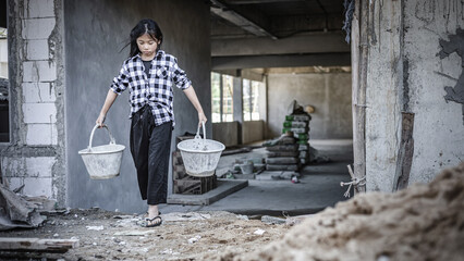 Children working at construction site for world day against child labor concept: