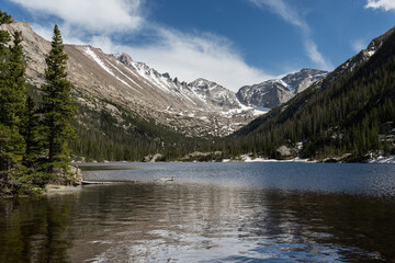 14,259 foot Longs Peak, is the highest mountain in Rocky Mountain National Park. Mills Lake is a travel destination for hikers, that catch the beautiful views of the mountains.