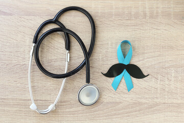 Stethoscope and blue ribbon symbol of prostate cancer awareness