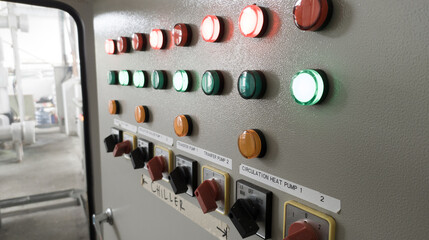 Close-up of lit  lights and Control Switch on a industrial control chiller with shiny lights . - Powered by Adobe