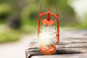 Retro Lantern with a candle light on outdoor background