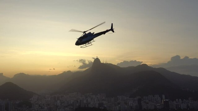 Helicopter flys past the Christ the Redeemer Statue in Rio de Janeiro, Brazil