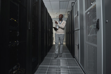 Technician, cybersecurity and man in the server room for data maintenance, it or analysis. System,...