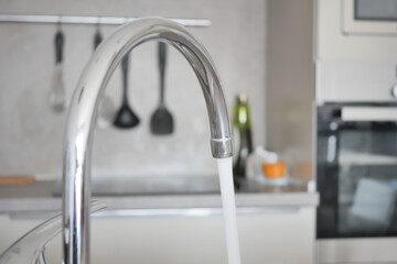 water pouring from a faucet tap slow motion 
