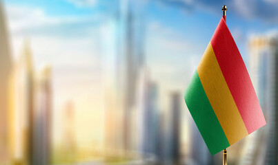 Small flags of the Bolivia on an abstract blurry background