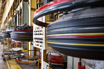 Raw automobile tires along production plant storage