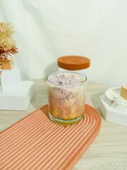 pink matcha with latte foam in glass.