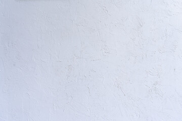 Texture of white plaster on a handmade concrete wall. Construction, interior design.