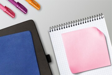 Blank Sticky note with stationery items on the desk