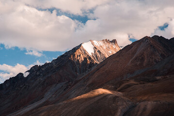 Plakat beautiful scene of orange morning light touch the peak of the mountain in Pangong tso, Leh Ladakh, India