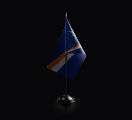 Small national flag of the Marshall on a black background
