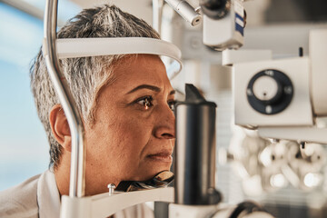 Optometry, slit lamp and eye exam by senior woman or patient with medical insurance using machine....