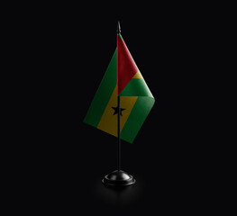 Small national flag of the Sao Tome and Principe on a black background