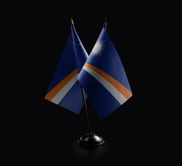 Small national flags of the Marshall on a black background