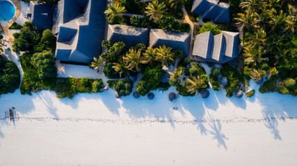 The Indian Ocean beach in Zanzibar, Africa, is a breathtaking sight from above. The sandy shore is...