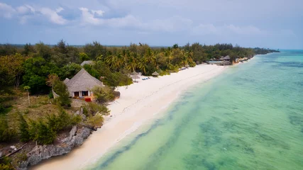 Cercles muraux Plage de Nungwi, Tanzanie Aerial drone photography captures the breathtaking beauty of Zanzibar's crystal clear waters and white sandy beaches in Nungwi.